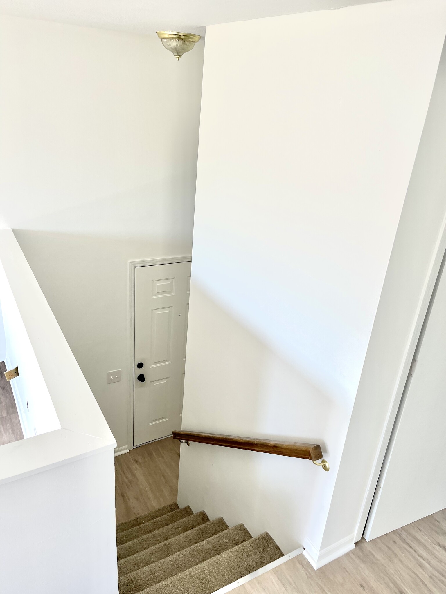 View of both levels looking at the front door with brand new carpet - 1921 Acorn Road