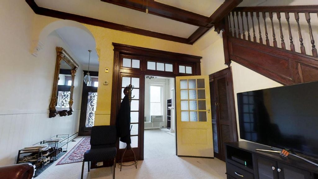 ENTRANCE HALL and WELCOME SPACE with VIEW TO LIVING ROOM THROUGH FRENCH DOORS - 2937 N Charles St