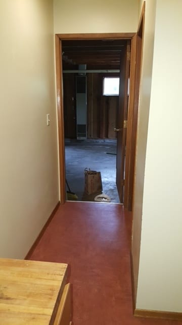 Hallway off kitchen to laundry on right and garage - 9514 SW Capitol Hwy