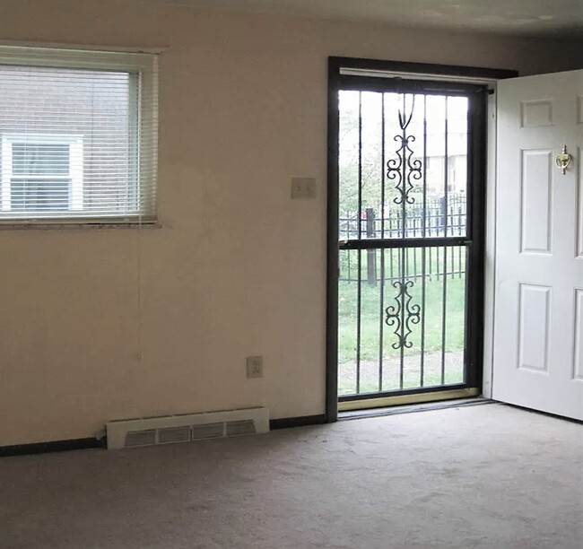 Livingroom and front entry door - 404 Brierly Ln