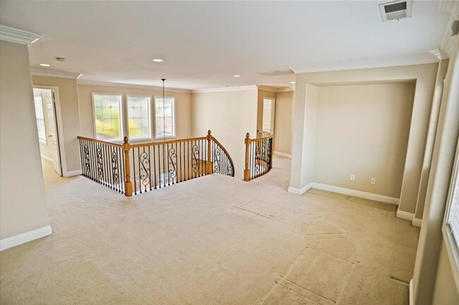 Building Photo - "Spacious 4-Bedroom Retreat with Cozy Fire...