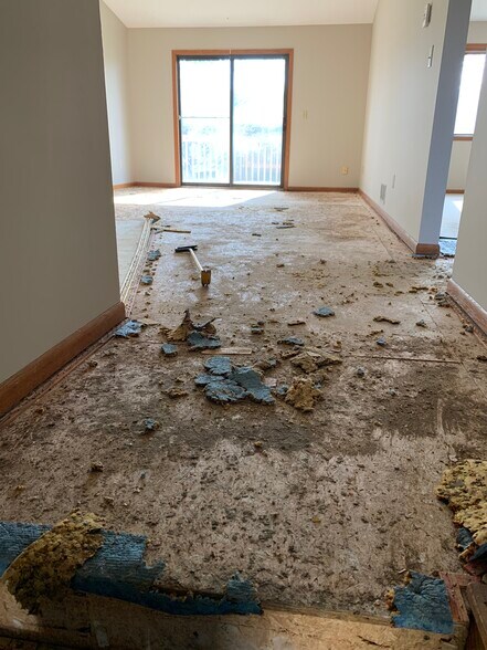Demo underway for new flooring on main level. - 2044 Bradley St