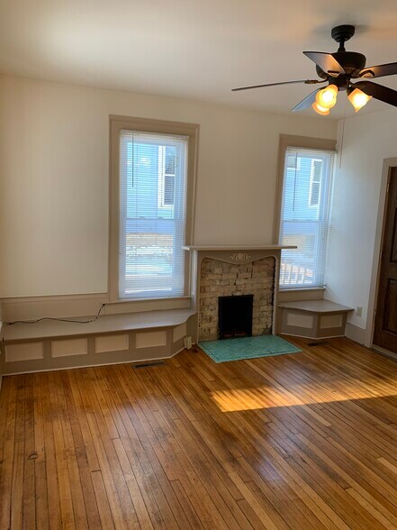 Living room with brick fireplace - 1034 Spaight St