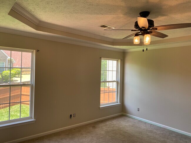 Master bedroom with tray ceiling - 709 Warmstone Ct