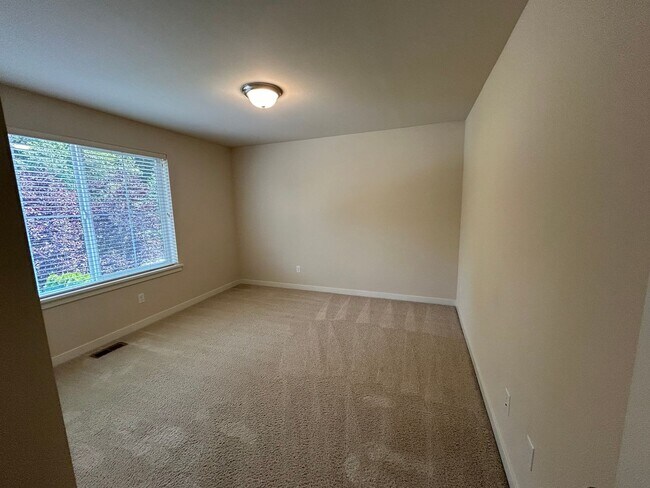 Building Photo - 4 bed/2.5 bath and 3 car garage and a down...
