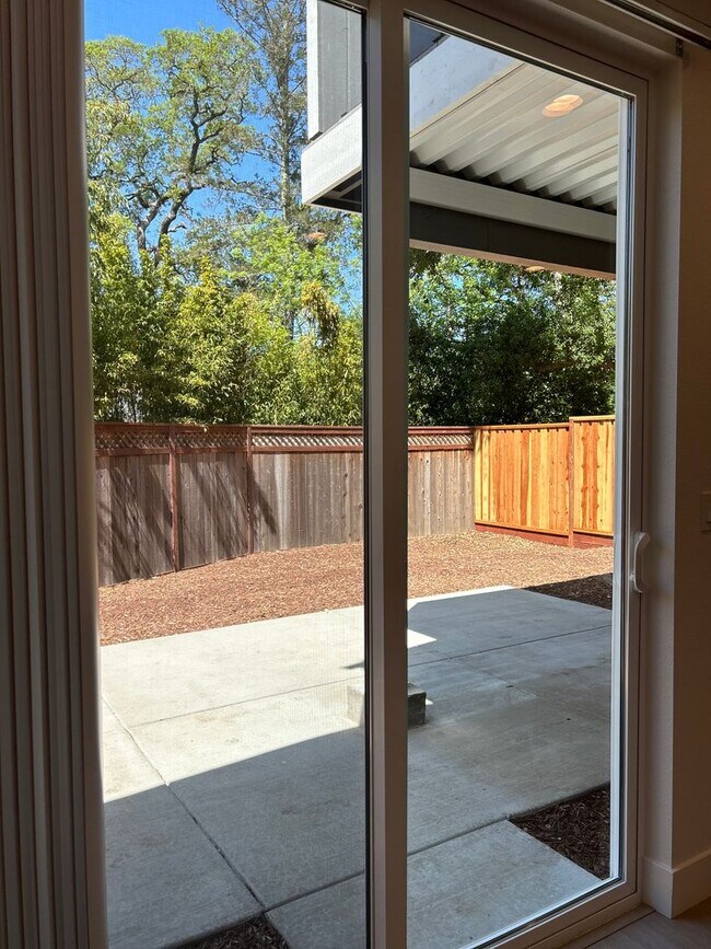 Building Photo - Coming soon! Lower unit  2 bed 1 bath townhome with attached garage