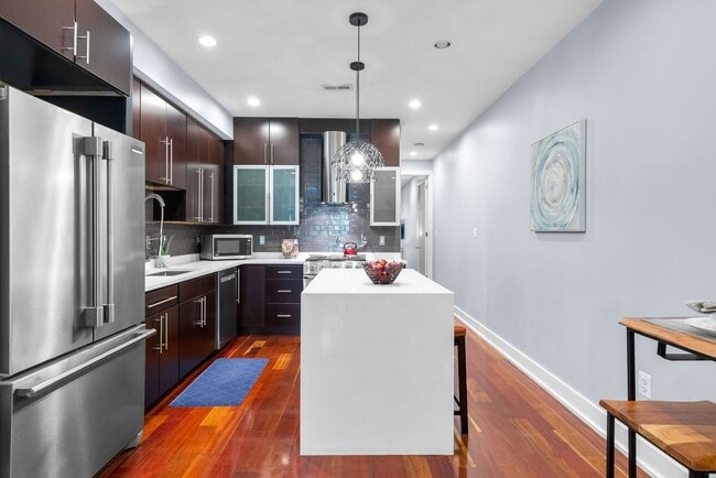 Building Photo - Stylish 2-Level Condo with Private Yard & Chef’s Kitchen Near Petworth Metro!