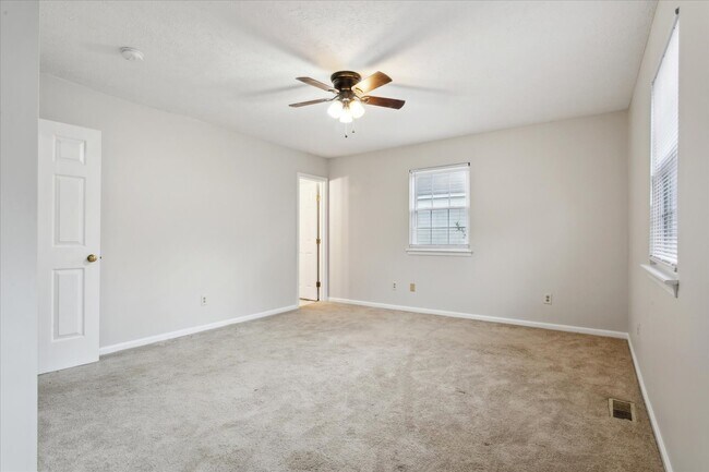 The home offers three spacious bedrooms! - 1644 Skiffes Creek Cir