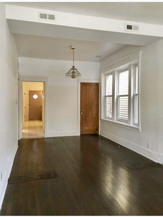 Dining and Living Room area facing walkway to kitchen. - 3811 N Whipple St