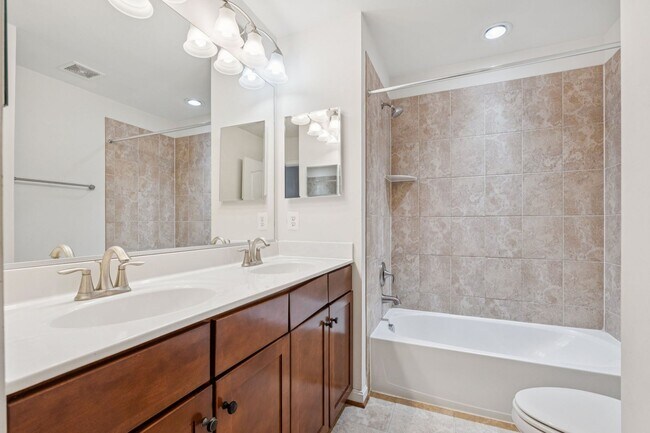 Building Photo - This beautifully maintained end-unit brick...