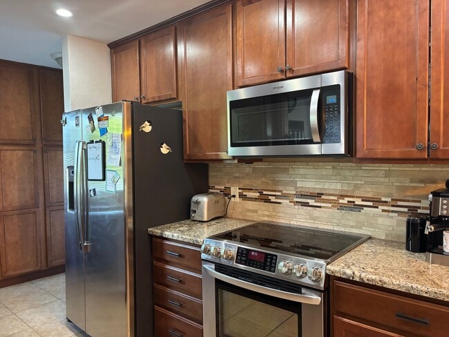 Building Photo - Welcome to this stunning updated 2-bedroom, 2-bathroom home on a lake located in the vibrant comm...