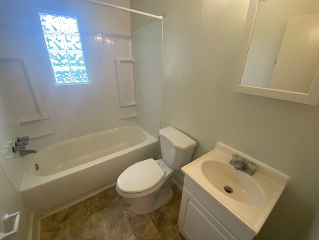 Building Photo - Private carport, in-unit laundry, and the Lakewood strip right outside your door.