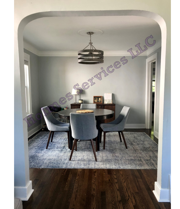 Dining room - Open floorplan, view from living room, hall to bedrooms in back right corner. - 526 Academy St