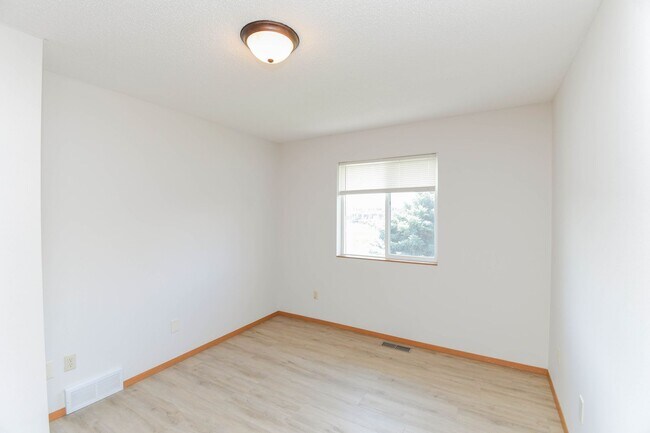 Building Photo - Updated 3BR Split-Level Home with Huge Deck, Fenced Yard & 2-Car Garage Near I-29!