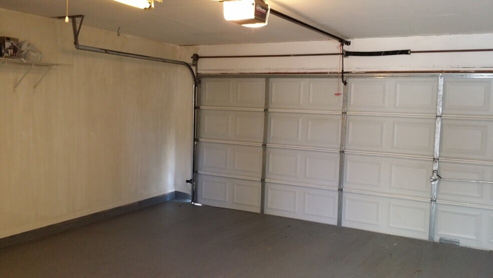 Garage totally remodel Custom workshop space in garage with numerous built-ins. - 2110 village crossing trail