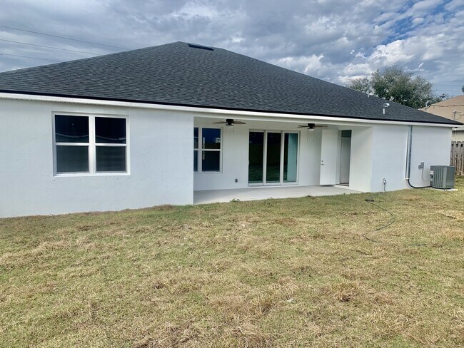 Building Photo - "Spacious 4-Bedroom 3-Bath with In-Law Suite & Granite Finishes in Palm Bay!"