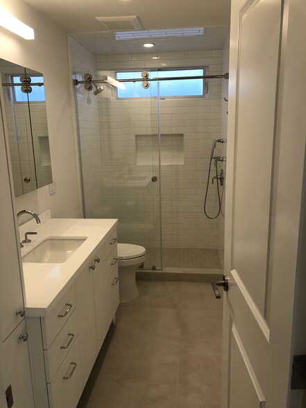 new full bathroom w/walk in shower and storage - 518 Dahlia Ave