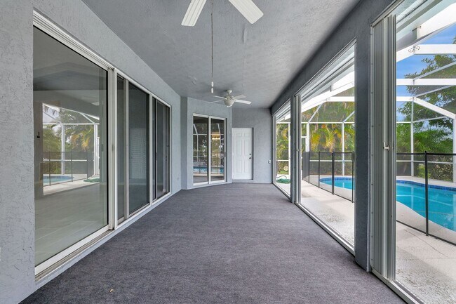 Building Photo - A BOATER'S PARADISE WITH THIS STUNNING 3 BEDROOM, 2 BATH WATERFRONT POOL HOME W/DOCK & BOAT LIFT ...