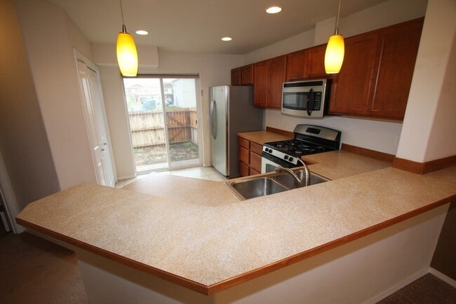 Building Photo - 3 Bedroom East Anchorage Condo w/ Fenced Yard!