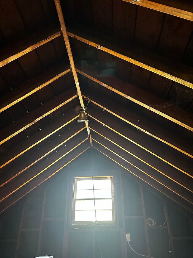 Attic has windows & a pitched beam ceiling, so you can stand fully. Storage with lots of room! - 924 Nowita Pl