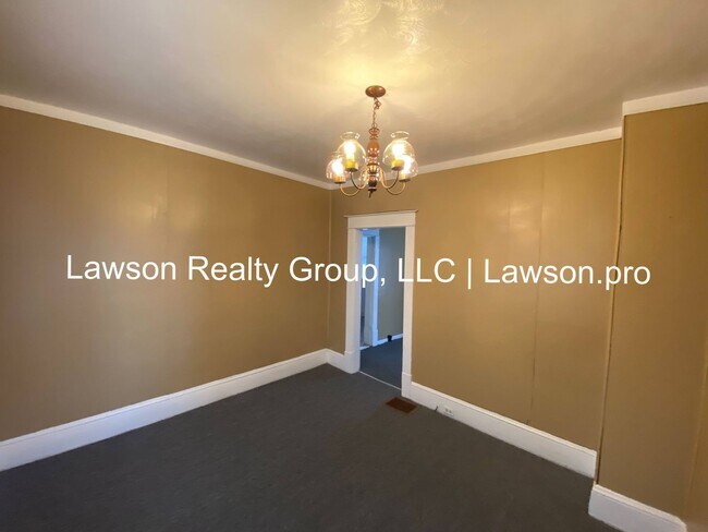 Building Photo - Updated Three Bedroom with Flat Yard