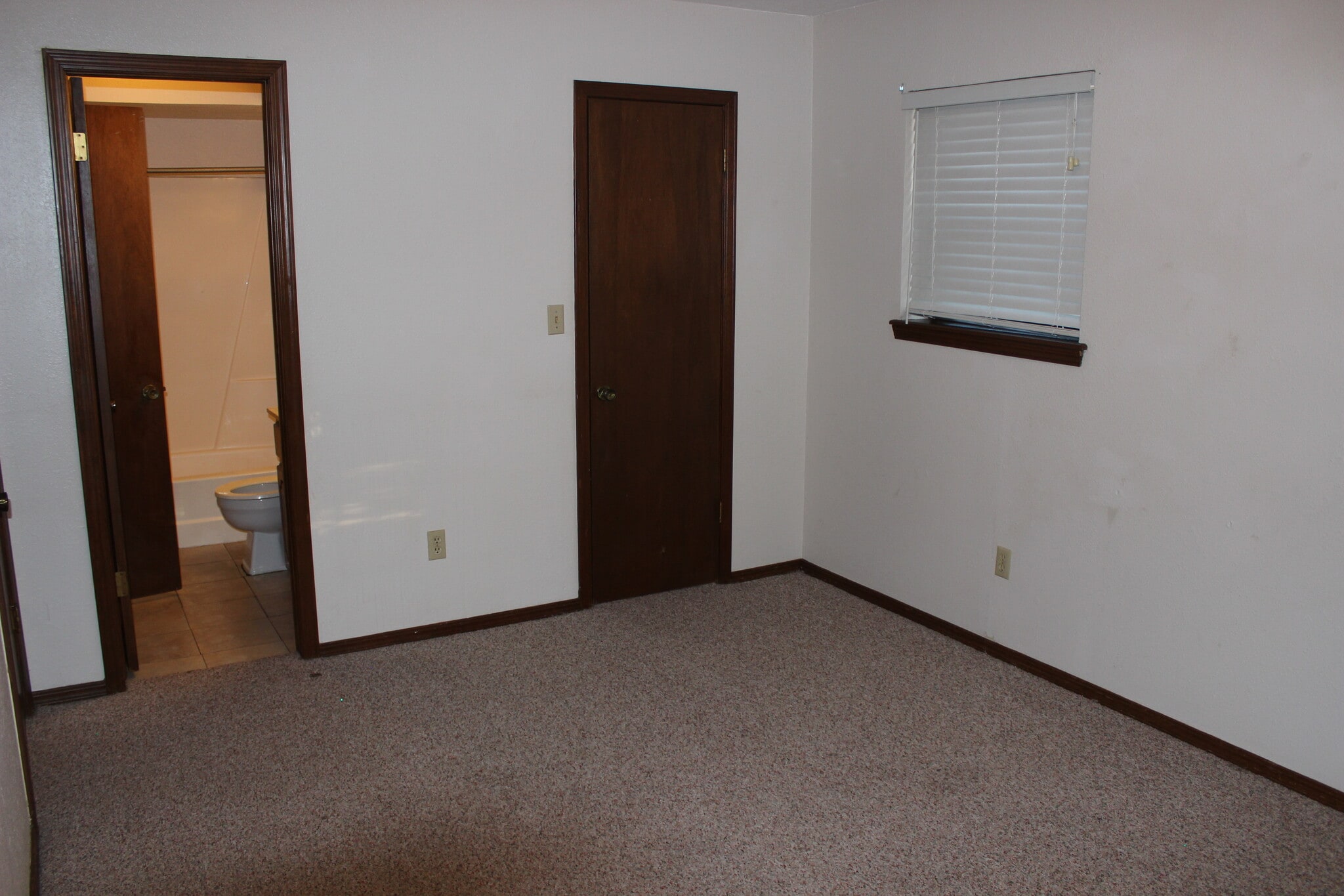 Bedroom One view with Main Bathroom and Walk-in Closet - 908 Acacia Cir