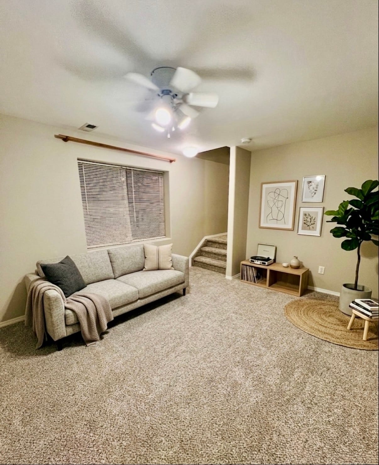 Finished basement living area, virtually staged to show possible furniture placement - 2563 Malpaso Pt