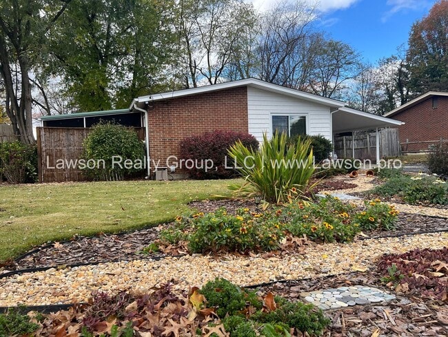 Primary Photo - Charming Brick Ranch with Beautifully Landscaped Yard and Attached Carport