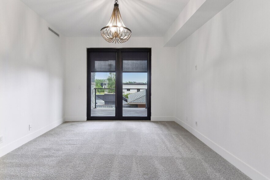 Retreat to the luxurious primary suite at the end of the day - 222 Ferndale Rd S