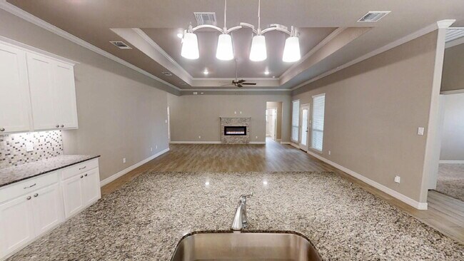 Building Photo - "Charming 4-Bedroom Retreat with Granite Elegance & Cozy Fireplace in Killeen!"