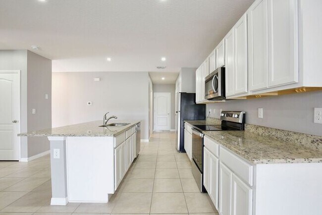 Building Photo - Move-In Ready 2BR/2BA Villa with Den + 2-Car Garage | Lake Nona Adjacent | Suncrest at St. Cloud