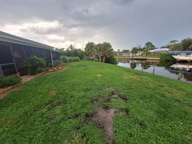 Building Photo - Gulf Access Home on Canal Available Now
