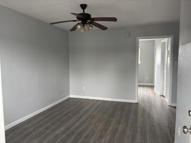 Building Photo - Corner & 1st Floor - Location, location, location! Become the newest neighbor at Palm Garden Apar...
