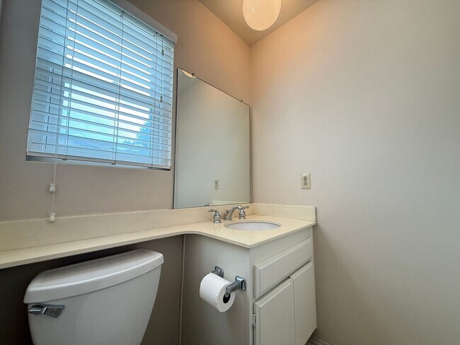 Building Photo - Move in Ready! 2BD Townhome! New Carpet! Two Patio Spaces! Attached Garage!