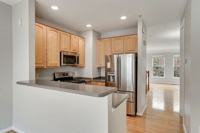 Building Photo - COMING SOON - Great 4 level end unit TH in...