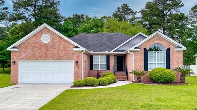 Building Photo - 4 Bedrooms, 2 Bathrooms in the Heart of Ri...