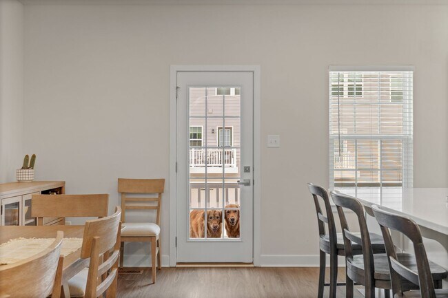 Building Photo - Luxurious three-story townhome with owner's suite and high-end finishes