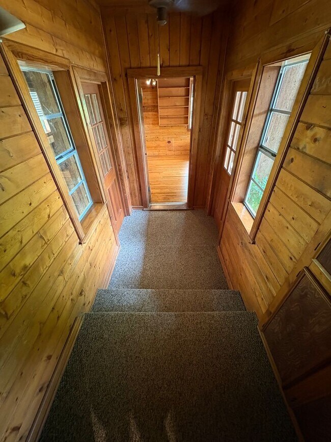 Building Photo - Storybook Cedar Home Down a Private Tree-Lined Drive