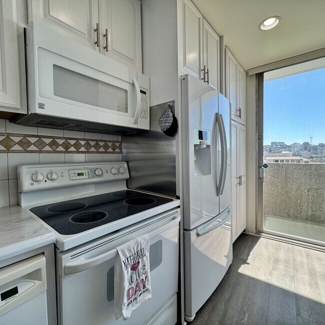 Building Photo - Just Unpack, Pour a Beverage, & Cue the Su...