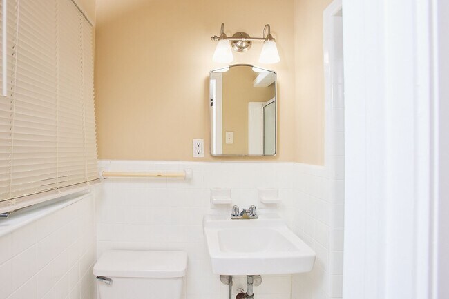 Building Photo - Vintage Charm with Modern Upgrades and Sunroom Living