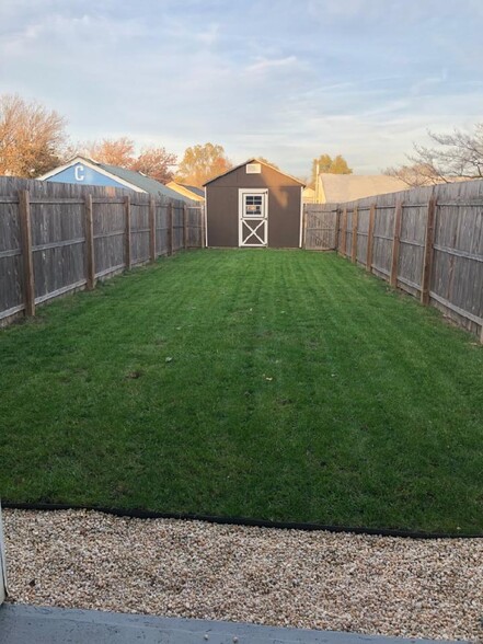 Fully Fenced Backyard; with shed - 212 W 6th Ave