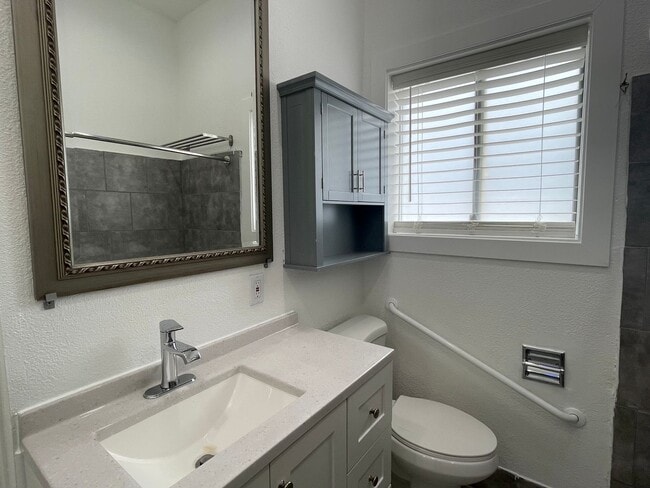 Building Photo - Updated 2 bedroom, large fenced back yard and WATER/SEWER INCLUDED IN RENT!