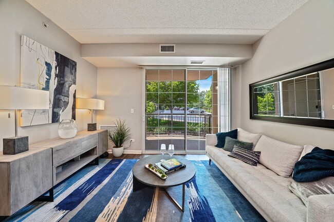 Living room with patio access and natural light - The Easton Downers Grove