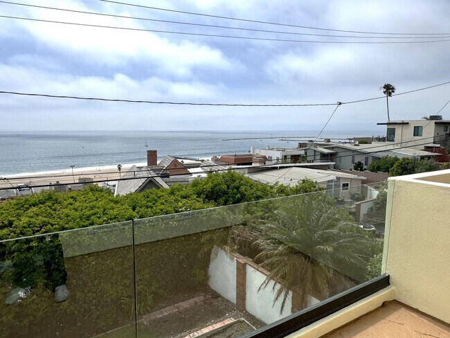 Building Photo - EXPANSIVE OCEAN VIEW from 2 balconies, VALUE Price in PDR