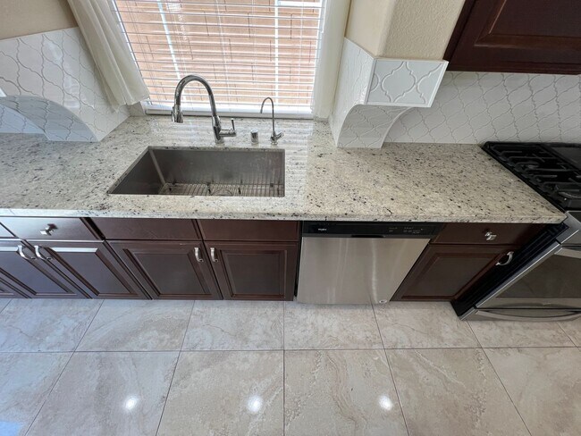 Building Photo - A Fantastic 4 Bedroom Home with the primary Downstairs, in Silverado Ranch