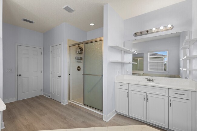 Building Photo - Spacious 6-Bedroom Home Near Lake Nona | 3-Car Garage + Tesla Charger