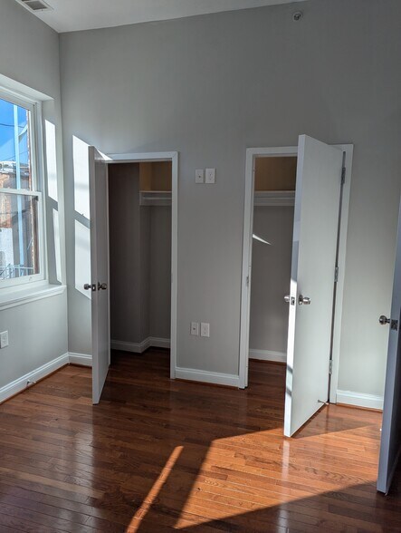 Bedroom with double closet. Room will fit a Queen - 2024 N Calvert St