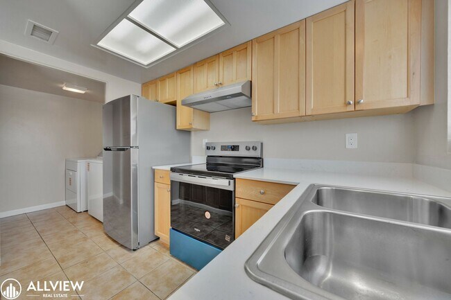 Building Photo - Beautifully Renovated 2-Bedroom Corner Tow...
