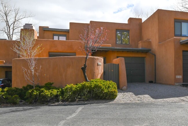 Building Photo - Two Story Condo Just off Old Taos Highway ...