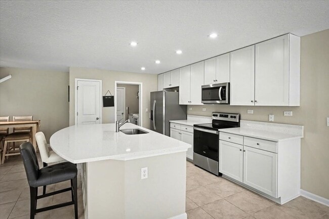 Building Photo - Beautiful Open Layout 4 Bed, 3 Full Bath | A True Masterpiece Backing to a Peaceful Pond with Mod...
